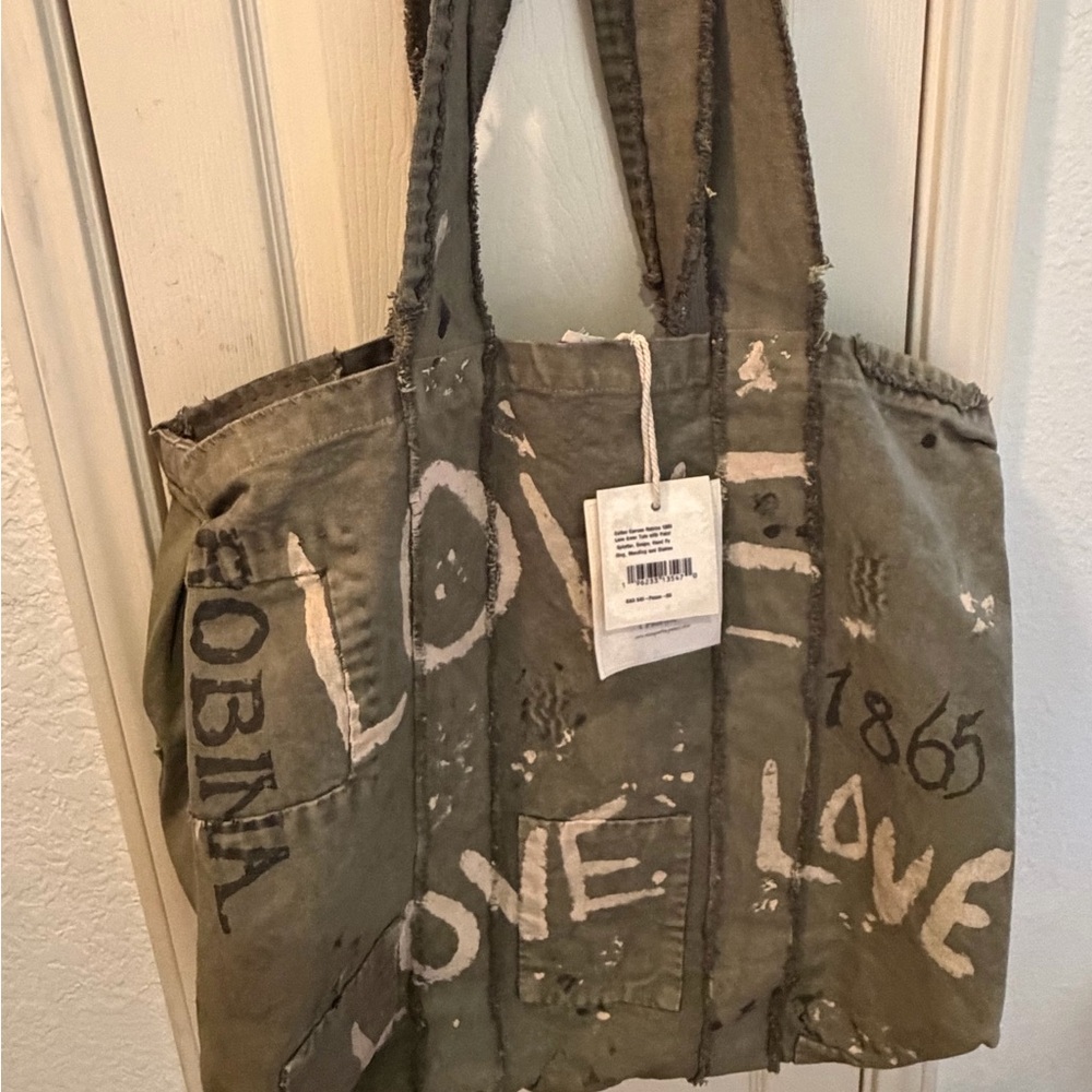 Magnolia Pearl Olive Green Canvas Tote with Cream and Black Lettering.